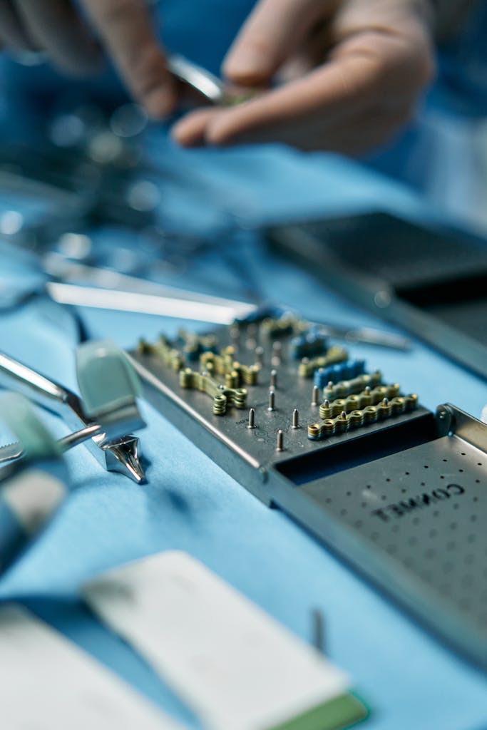 Dental surgical instruments on a table ready for use in a procedure.